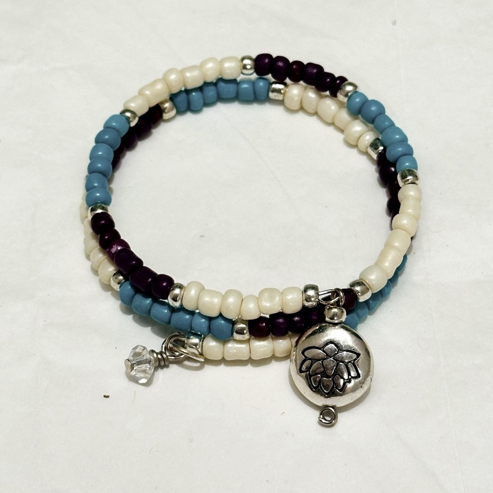 Handmade Blue/Purple/Cream Bracelet. Lotto Flower Charm. Made with Memory Wire.